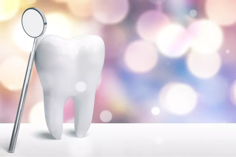 Ząb i lustro dentystyczne